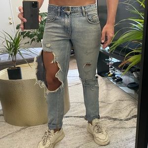 Blown out knee jeans